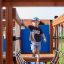 Child playing on Majestic ship with slide playground equipment