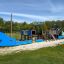 Playground equipment Majestic Ship with Slide, blue and wooden structure in the shape of a ship, out