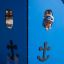Majestic ship with slide, blue playground equipment with a kid peeking through the window