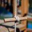 Wooden play structure with climbing rope on Majestic ship with slide.