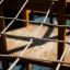 Wooden play structure with rope net on Majestic ship with slide.