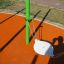 Single swing seat of the Hammock single swing on orange playground surface