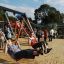 Children playing on Double Swing with Tower playhouse with slide.