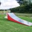 Outdoor playground Ramp for kids on grass field.