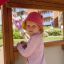 Child playing on Romping Center single slide at a playground.