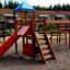 Playground equipment Romping Center with a single slide and climbing structures