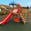 Romping Center single slide playground equipment with a red slide and climbing structures