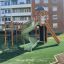 Playground Twister castle with slide in a residential area.