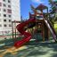 Twister castle with slide in a playground setting