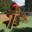 Twister castle with slide on playground with climbing wall and ladders