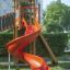 Twister castle with slide in a playground setting