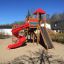 Twister castle with slide in a playground on a sunny day