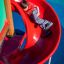 Child sliding on Twister castle with slide.