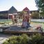 Children playing on Gorilla playground with slides and climbing structures.