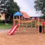 Playground equipment Gorilla with slides and climbing structures in a sandy play area
