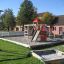 Playground structure Gorilla with slides and climbing features in an outdoor play area.