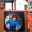 Children playing in the Motor Function Center wooden playhouse.