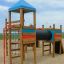Wooden Motor Function Center playhouse with slides and climbing features