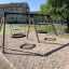 Double Swing (BNS 90cm) on a playground in a residential area.