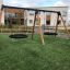 Double Swing (BNS 90cm) playground equipment in a park.