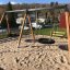 Double Swing (BNS 90cm) on a sandy playground.