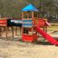 Square Play castle with slide in playground