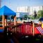 Square Play castle with slide in a playground setting