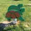 Turtle rocking playground spring rider in green and brown on grass