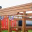 Eco-friendly wooden playground equipment from Searobber Castle with slide.