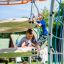 Children playing on Andromeda, steel structure climbing frame