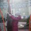 Child playing on Andromeda steel structure in playground