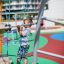 Child playing on Andromeda, steel structure climbing frame.
