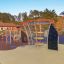 Andromeda steel structure playground equipment with climbing elements and slides.