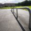 Rail 25/60 at an outdoor skate park on a sunny day