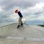 Child skateboarding on Fun Box 13 at a skate park.