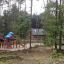 Tritowers castle with slide in a forest playground.