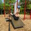 Man exercising on New Age Fit MEDIUM outdoor fitness equipment.