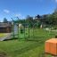 Outdoor fitness equipment New Age Fit MEDIUM in a green park area.