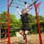 Person using New Age Fit MEDIUM outdoor gym equipment.
