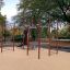 Outdoor fitness structure New Age Fit MEDIUM in a park setting.