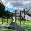 Outdoor fitness equipment New Age Fit MEDIUM in a park setting.