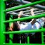 Person exercising on the New Age Fit MEDIUM outdoor monkey bars.