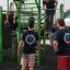 People exercising on the New Age Fit MEDIUM outdoor fitness structure.