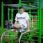 Man exercising on the New Age Fit outdoor fitness equipment.