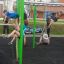 Children playing on New Age Fit outdoor exercise equipment.