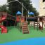 Space Station castle with slide on a playground with multiple play structures