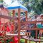 Children playing on Space Station castle with slide.