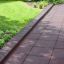 Rubber Tiles 55 safety flooring installed along garden path near grass and plants