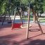 Rubber Tiles 75 under a playground swing set.