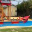 Fisher Boat ship playground equipment in outdoor play area.